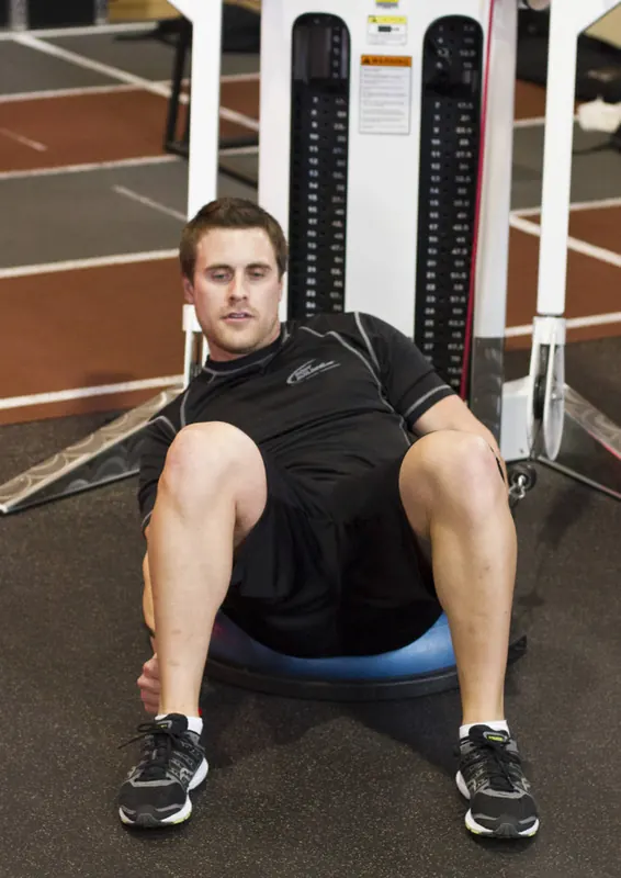 Bosu Ball Cable Crunch With Side Bends: end position