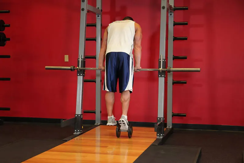 Calf Raise On A Dumbbell: end position