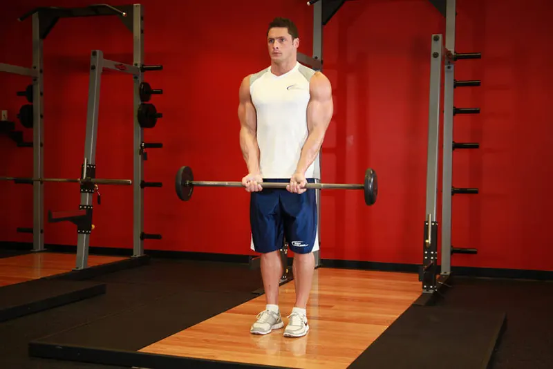 Close-Grip Standing Barbell Curl: starting position