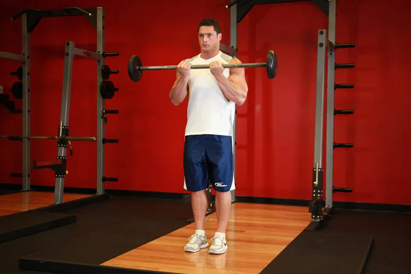 Close-Grip Standing Barbell Curl: end position