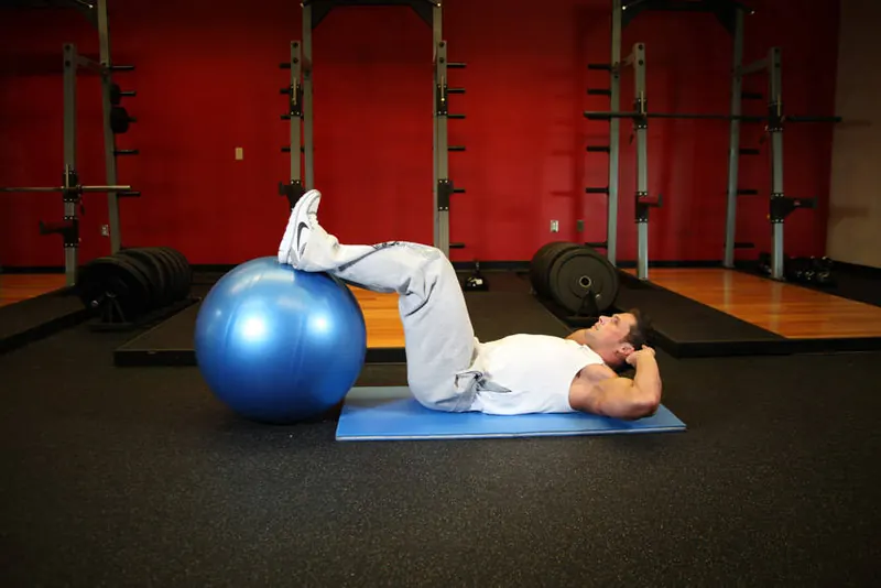 Crunch - Legs On Exercise Ball: starting position