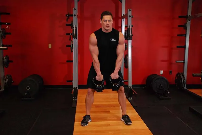 Double Kettlebell Alternating Hang Clean: starting position