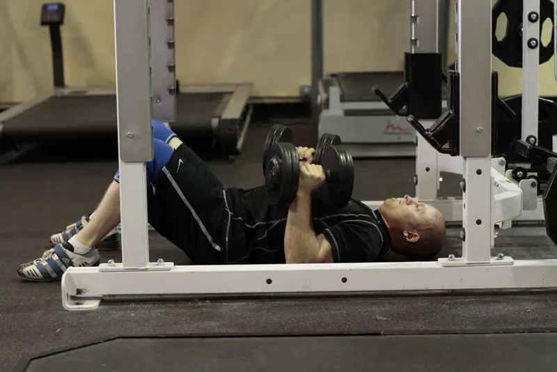 Dumbbell Floor Press: end position