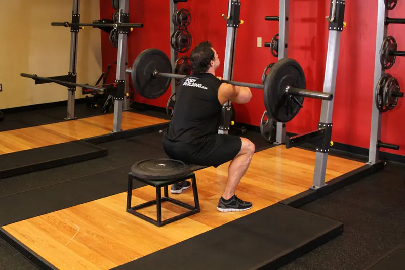 Front Barbell Squat To A Bench: end position