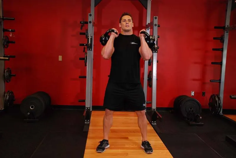 Front Squats With Two Kettlebells: starting position