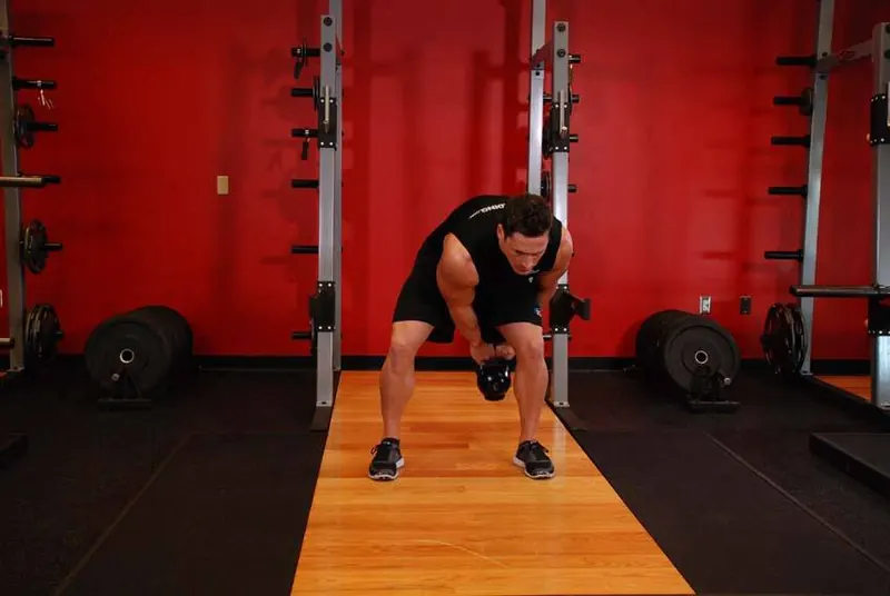Kettlebell Pass Between The Legs: end position