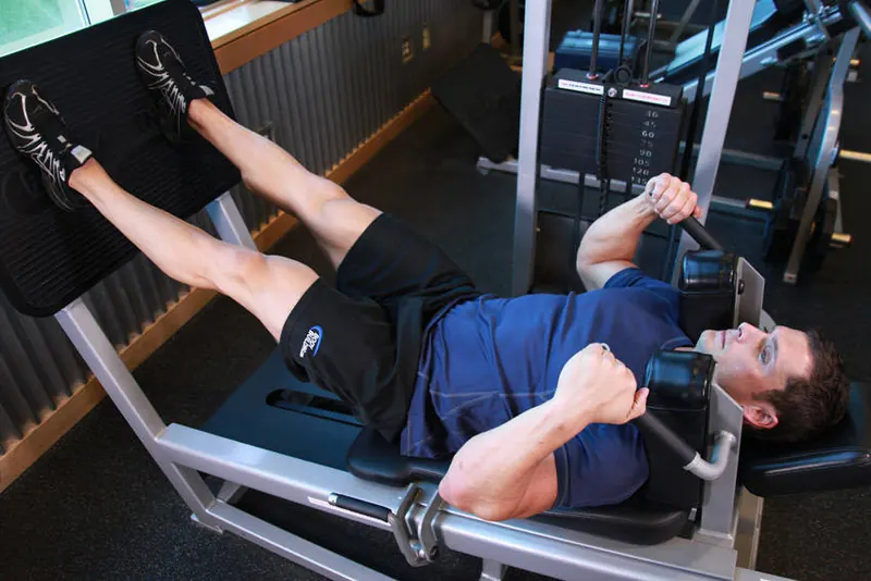 Lying Machine Squat: end position