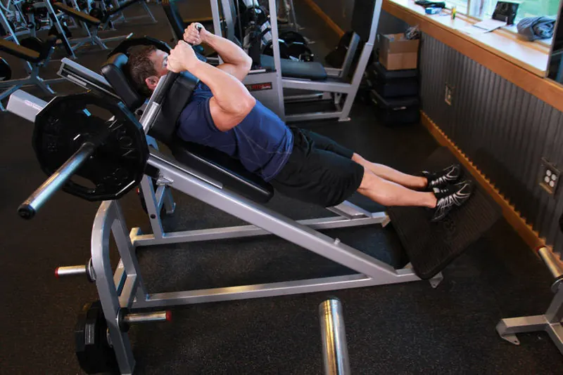 Narrow Stance Hack Squats: end position