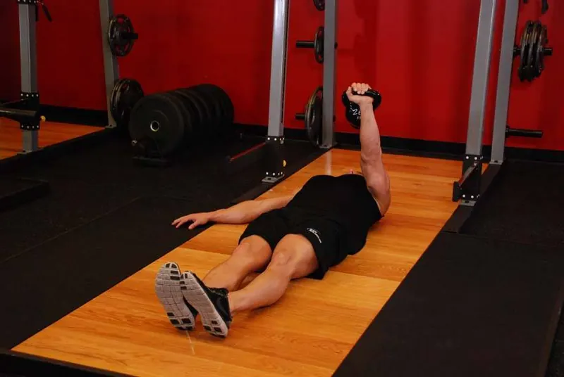 One-Arm Kettlebell Floor Press: end position