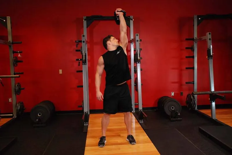 One-Arm Kettlebell Military Press To The Side: end position