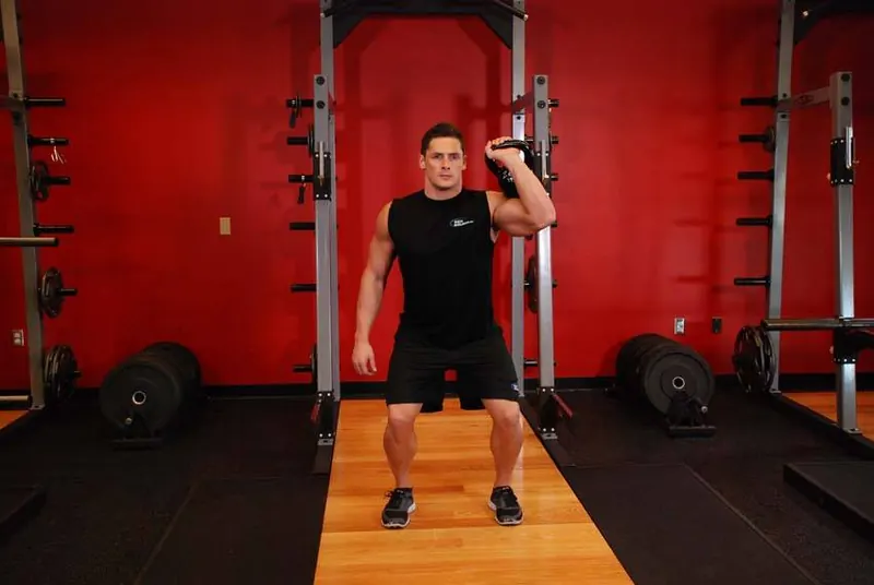 One-Arm Kettlebell Push Press: end position