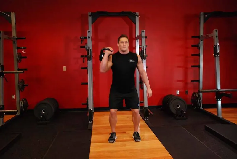 One-Arm Kettlebell Split Jerk: end position