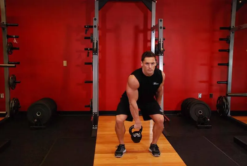 One-Arm Kettlebell Split Snatch: end position
