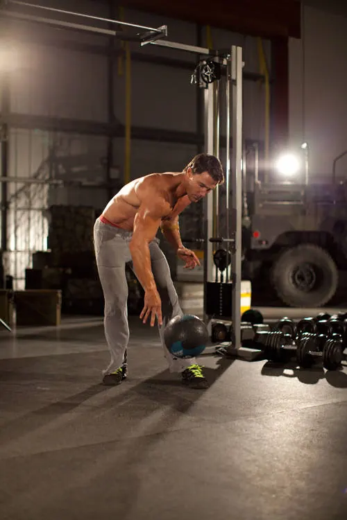 One-Arm Medicine Ball Slam: end position
