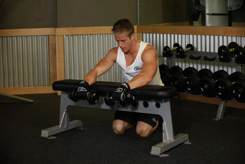 Palms-Down Dumbbell Wrist Curl Over A Bench: starting position