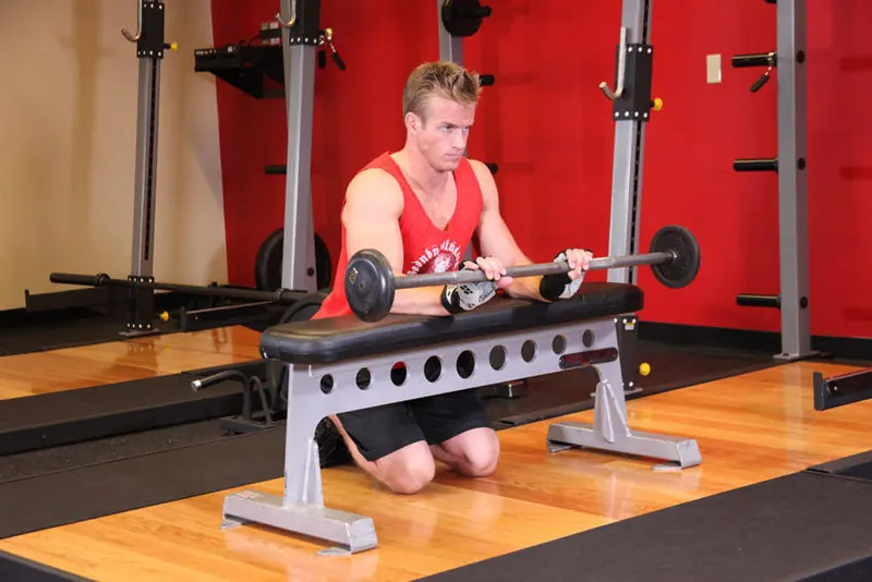 Palms-Down Wrist Curl Over A Bench: end position