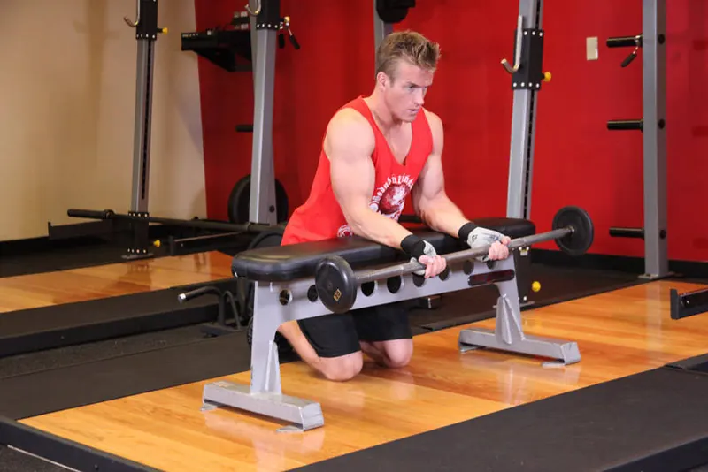 Palms-Up Barbell Wrist Curl Over A Bench: starting position