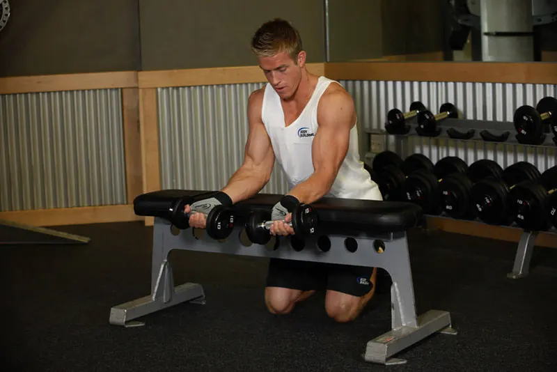 Palms-Up Dumbbell Wrist Curl Over A Bench: starting position