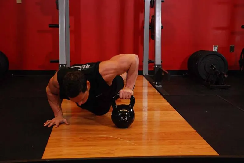 Plyo Kettlebell Pushups: starting position