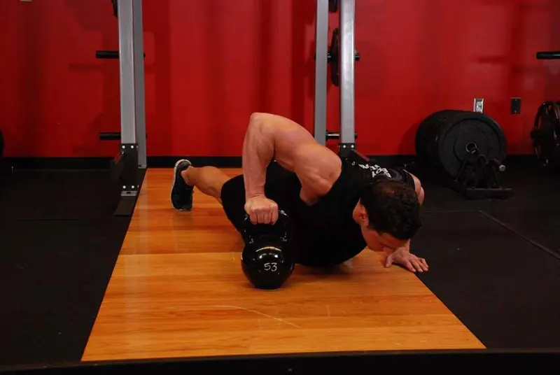 Plyo Kettlebell Pushups: end position