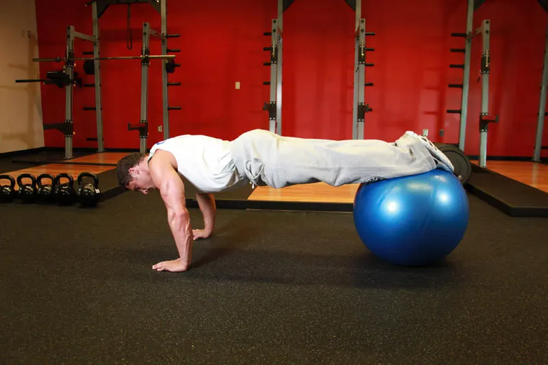 Push-Ups With Feet On An Exercise Ball: end position