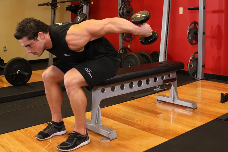 Seated Bent-Over Two-Arm Dumbbell Triceps Extension: end position
