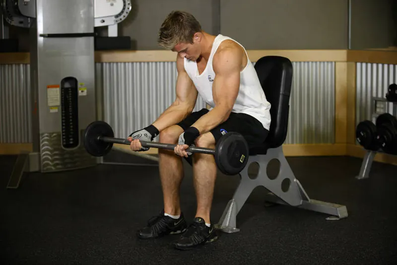 Seated Palm-Up Barbell Wrist Curl: starting position