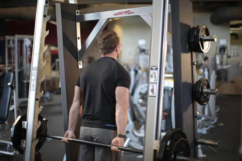 Smith Machine Behind the Back Shrug: starting position