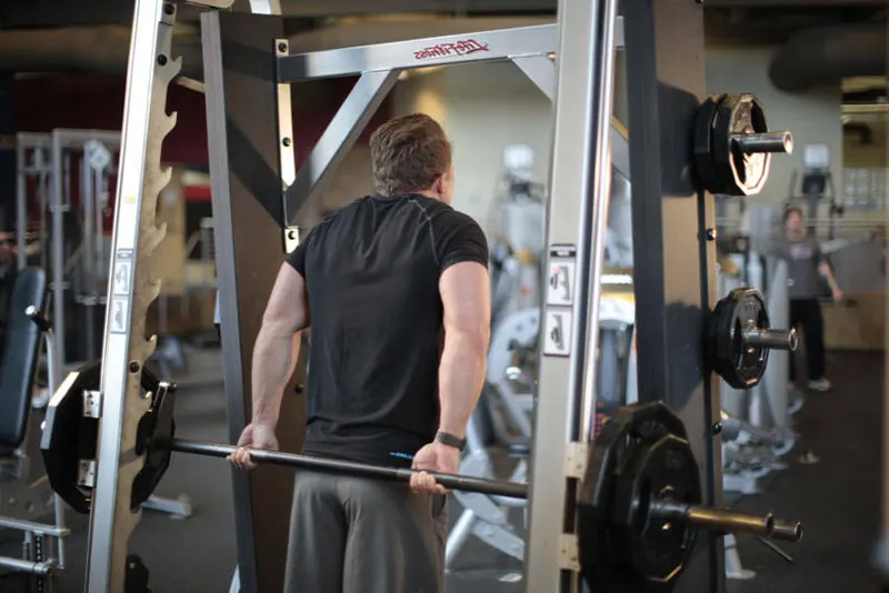 Smith Machine Behind the Back Shrug: end position
