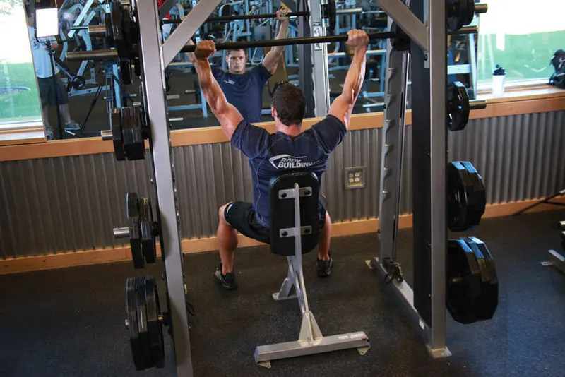 Smith Machine Overhead Shoulder Press: end position