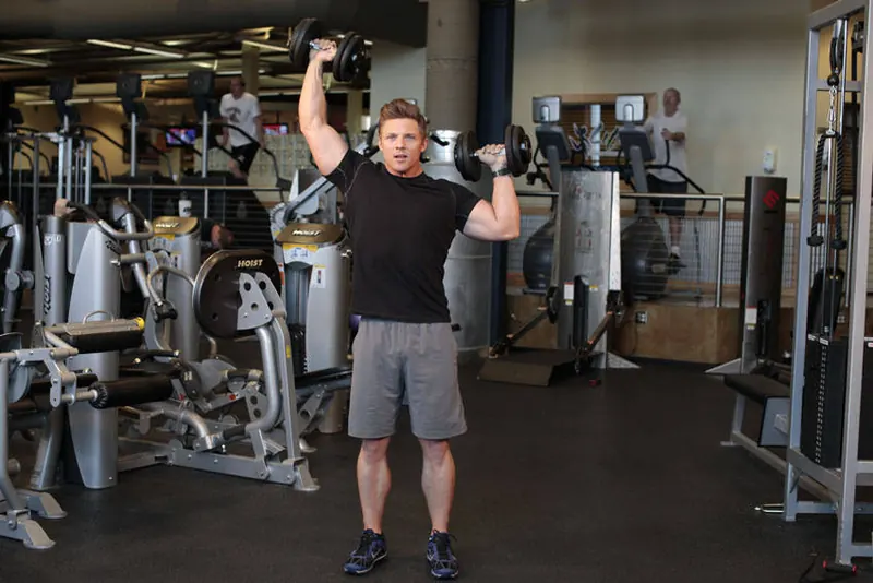 Standing Alternating Dumbbell Press: end position