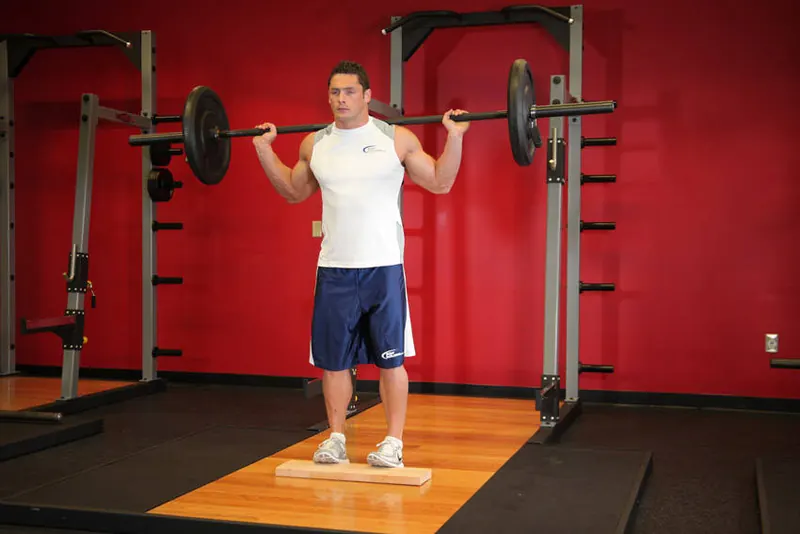 Standing Barbell Calf Raise: end position