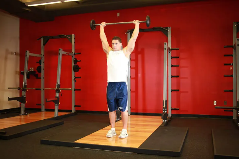 Standing Barbell Press Behind Neck: end position