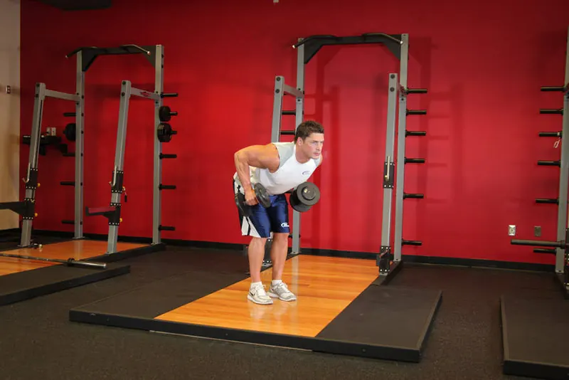 Standing Bent-Over Two-Arm Dumbbell Triceps Extension: starting position