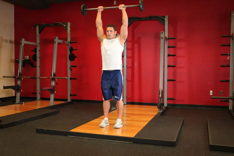 Standing Front Barbell Raise Over Head: end position