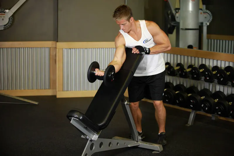 Standing One-Arm Dumbbell Curl Over Incline Bench: starting position