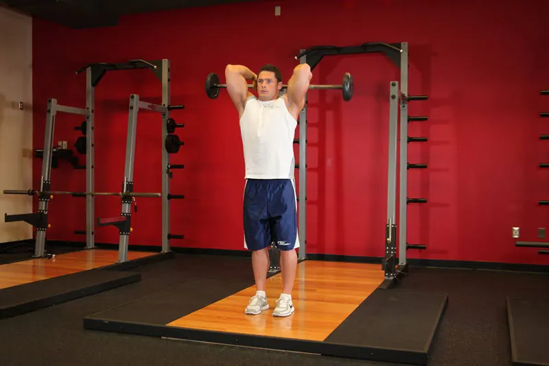 Standing Overhead Barbell Triceps Extension: starting position