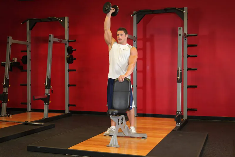 Standing Palm-In One-Arm Dumbbell Press: end position