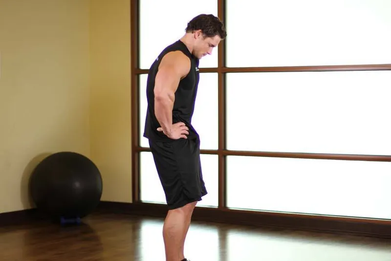Standing Pelvic Tilt: end position
