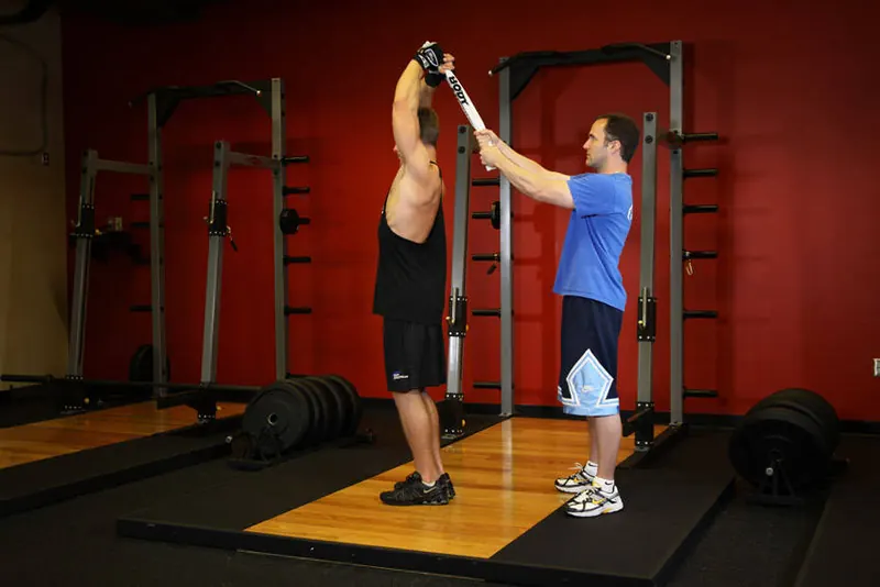 Standing Towel Triceps Extension: end position