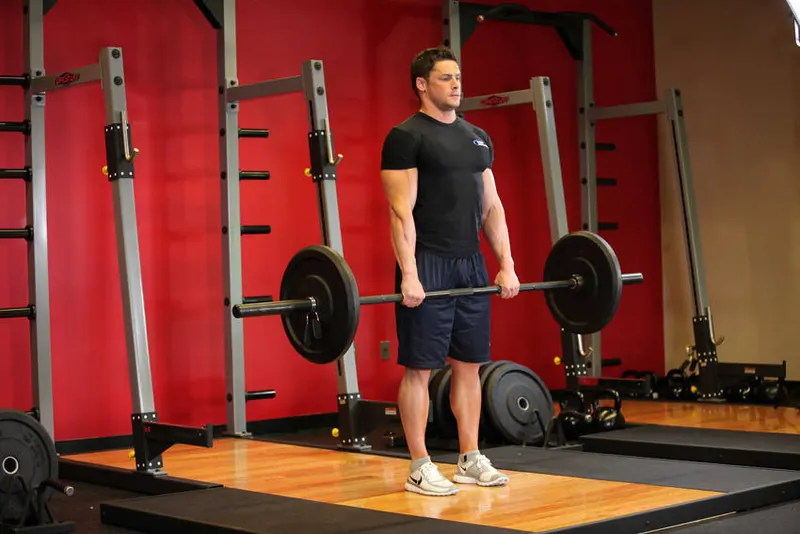 Stiff-Legged Barbell Deadlift: end position