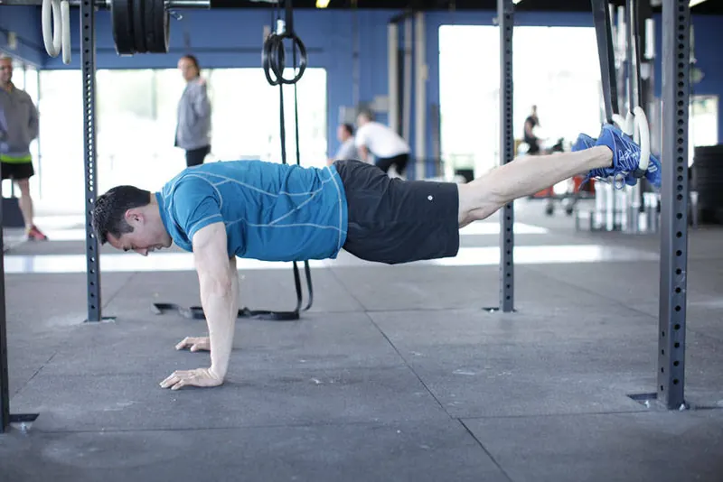 Suspended Reverse Crunch: starting position