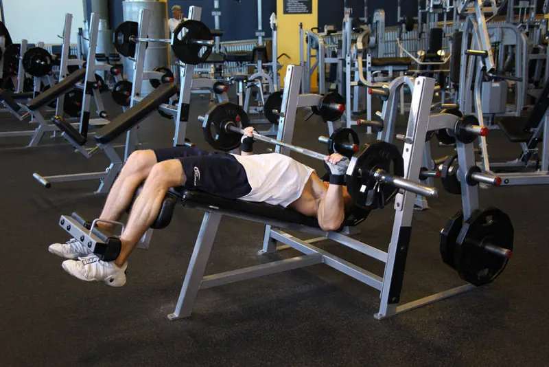Wide-Grip Decline Barbell Bench Press: end position