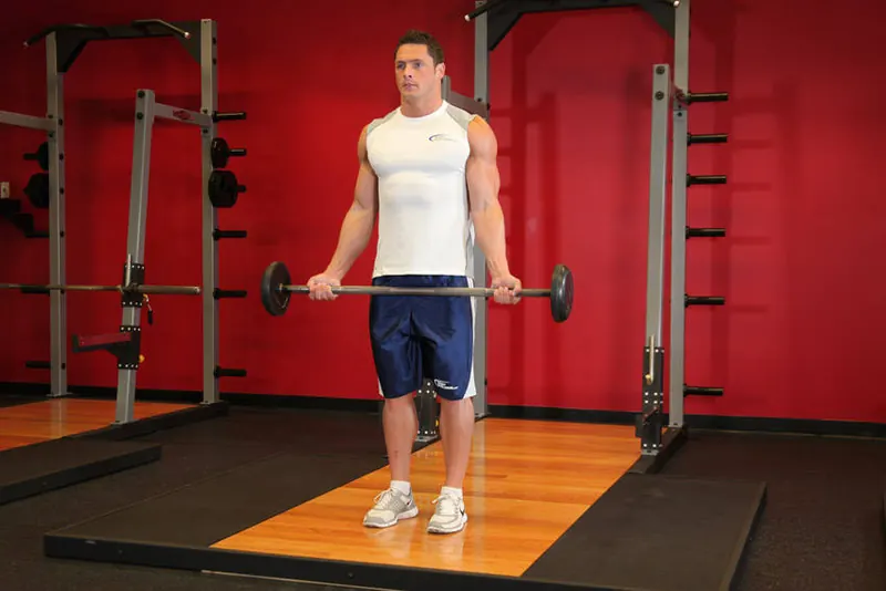 Wide-Grip Standing Barbell Curl: starting position
