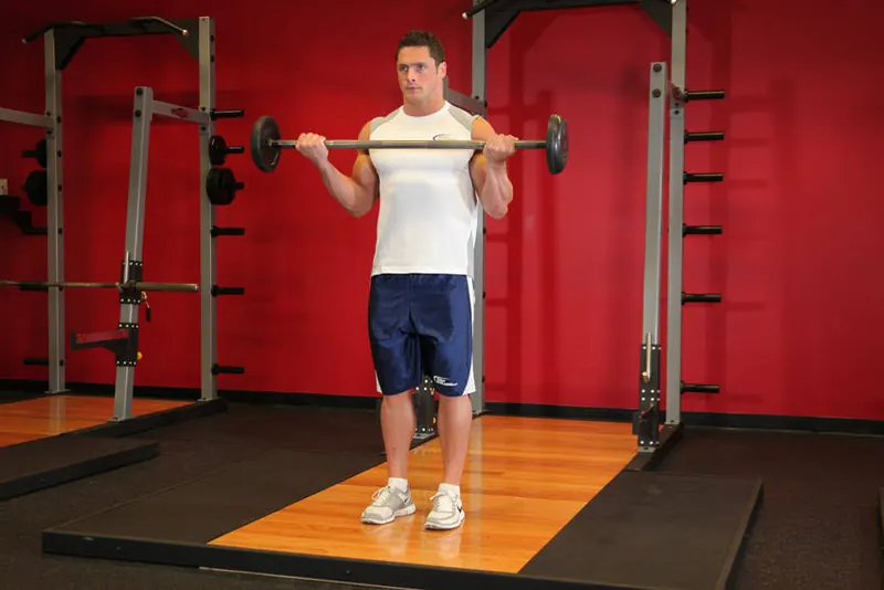Wide-Grip Standing Barbell Curl: end position